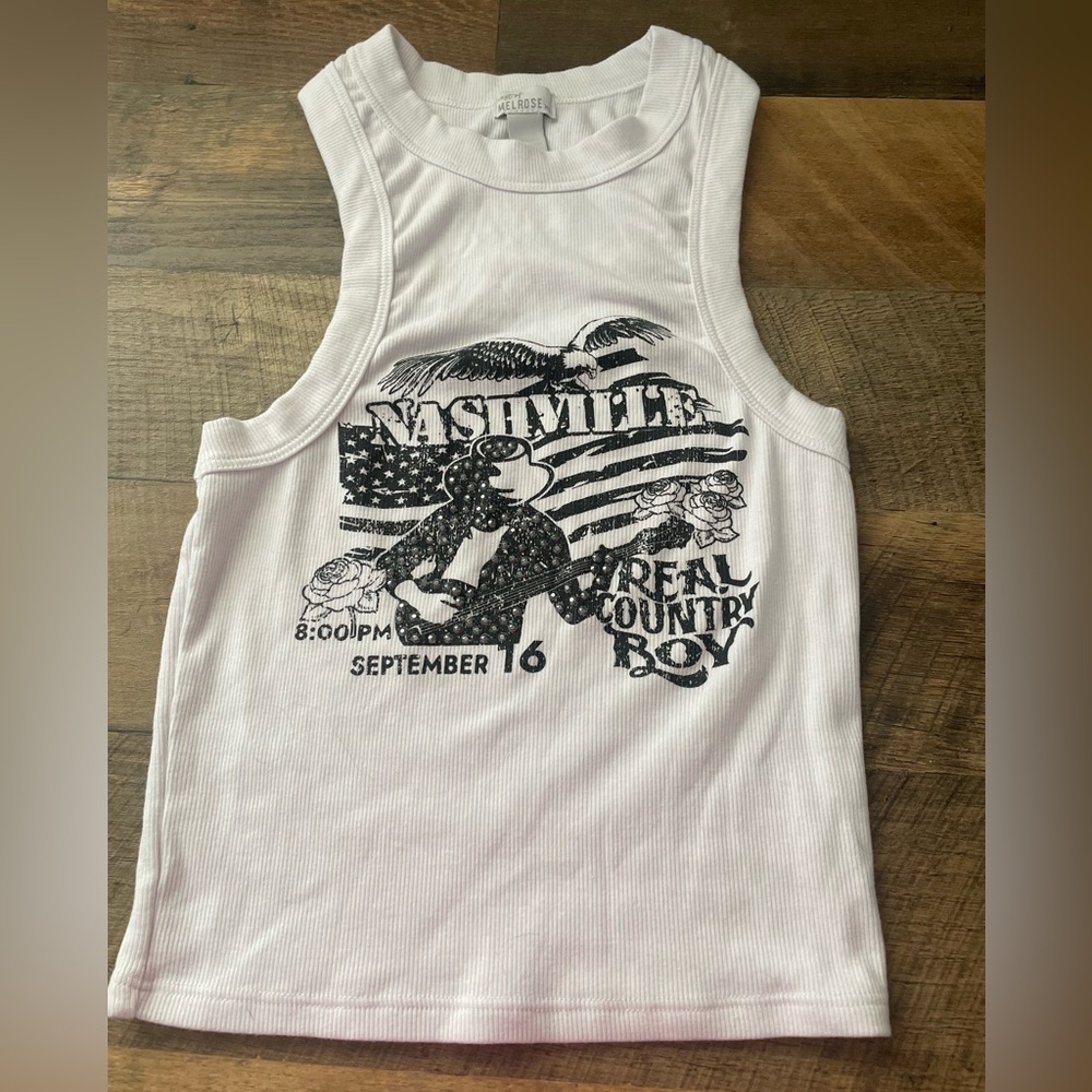 I’m selling this super cute bling tank top! It’s size XS but can fit a Small! 🤍